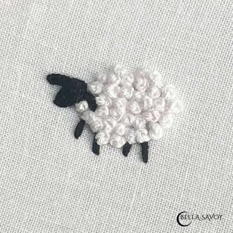 french knot creating the wool of a small lamb embroidery design