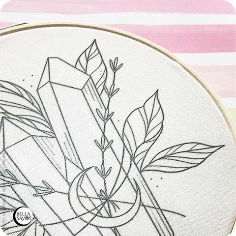 embroidery pattern transferred onto fabric and set in a hoop