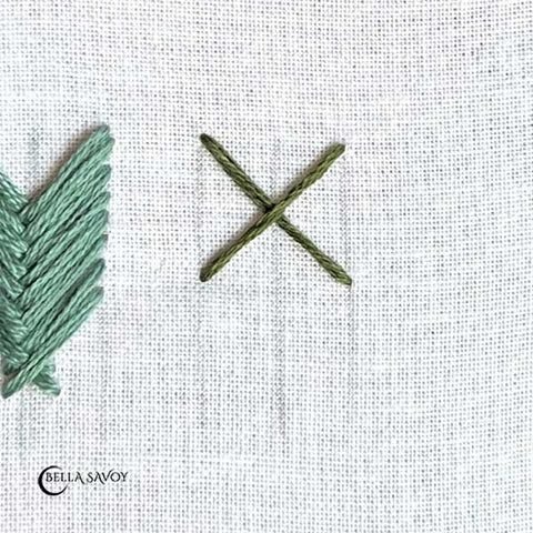 three parallel, vertical guidelines and a uniform 'X' stitched at the top