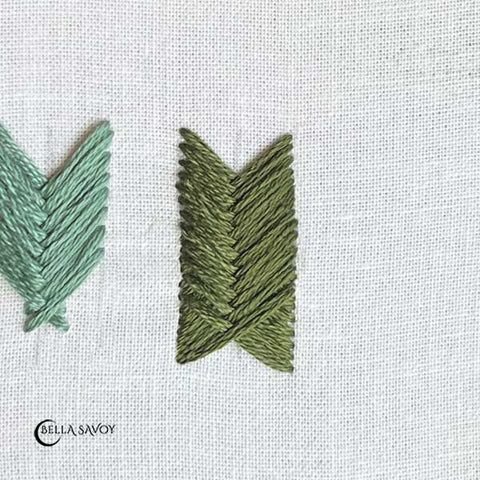 three parallel, vertical guidelines and a uniform 'X' stitched at the top