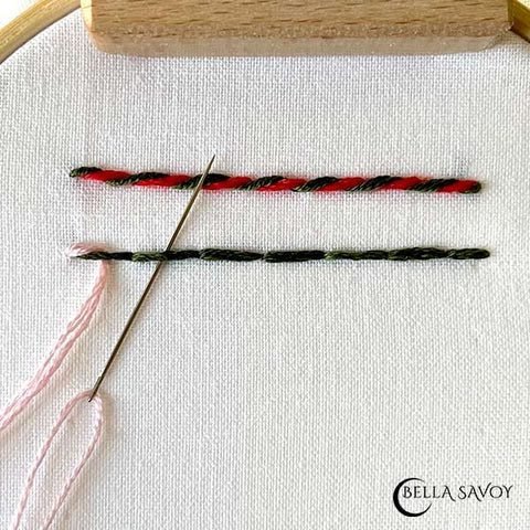 back stitch with pink thread weaving through each stitch like a snake