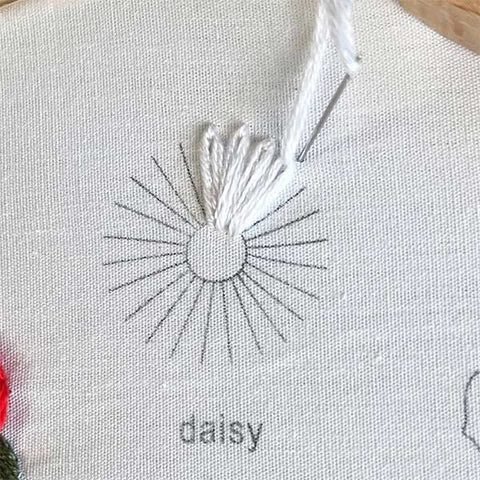 lazy daisy stitch being added to the daisy petal
