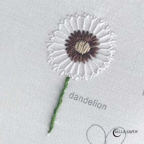 dandelion embroidered onto fabric