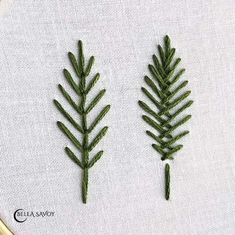 two embroidered open fill leaves