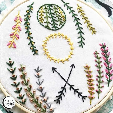 the fern stitch stitched to an embroidery hoop in various designs