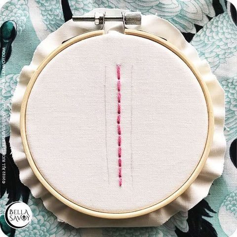 3 parallel lines with a back stitch down the center