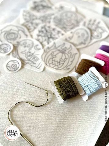 embroidery stick and stitch stickers next to thread and needle