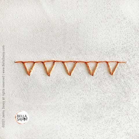 5 closed blanket stitches in orange