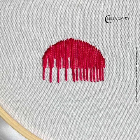 top half of circle filled with the long and short stitch