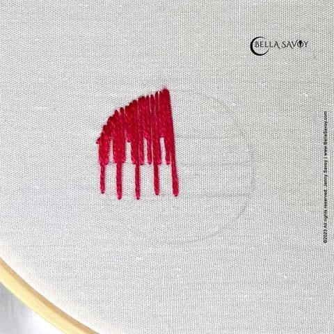 top left of circle filled with the long and short stitch