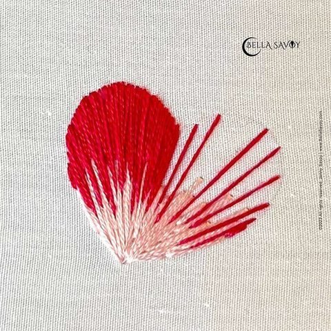 long and short filled heart in pink and red. Left side complete while right side is still in progress