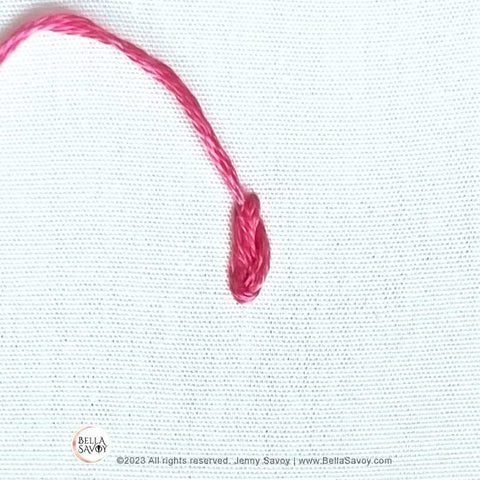 thread pulled through at the top of stitch