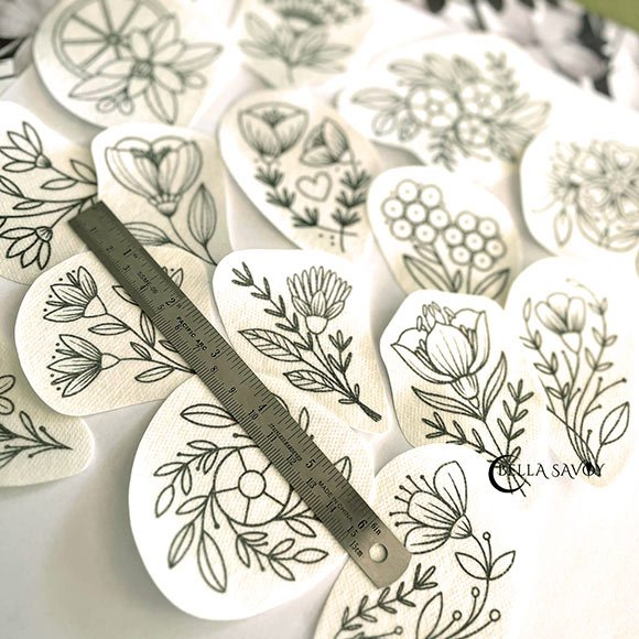 flower embroidery stick and stitch designs cut out and ready to be used as embroidery transfer stickers